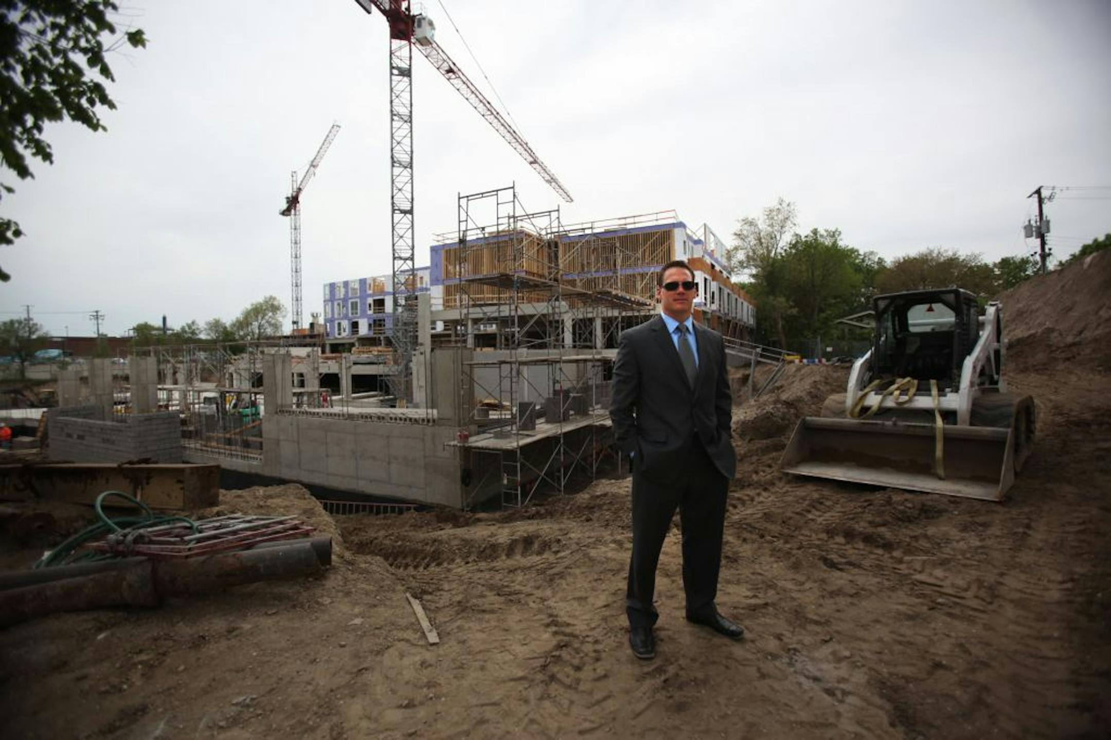 Project Manager Brent Rogers stood at the construction site for Flux, an up-scale apartment complex being built in Uptown.