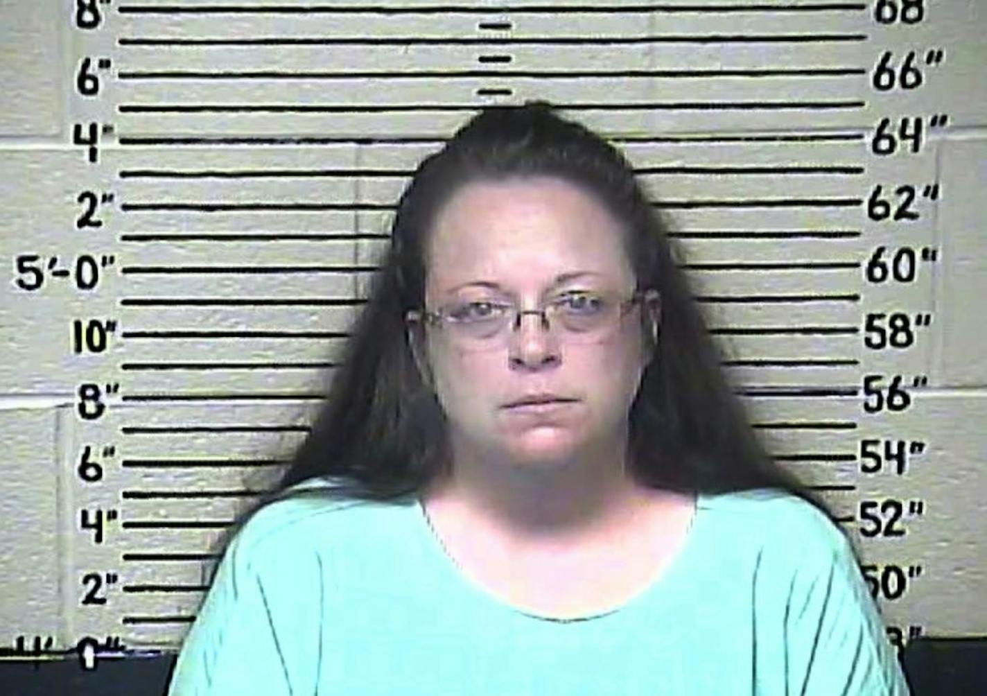 This Thursday, Aug. 3, 2015 photo made available by the Carter County Detention Center shows Kim Davis. The Rowan County, Ky. clerk went to jail Thursday for refusing to issue marriage licenses to gay couples, but five of her deputies agreed to comply with the law, ending a two-month standoff. (Carter County Detention Center via AP) ORG XMIT: MIN2015090317315660