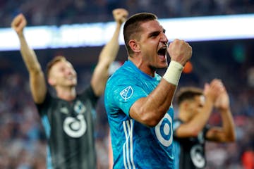 Vito Mannone, foreground, celebrates with his team after a win over FC Dallas