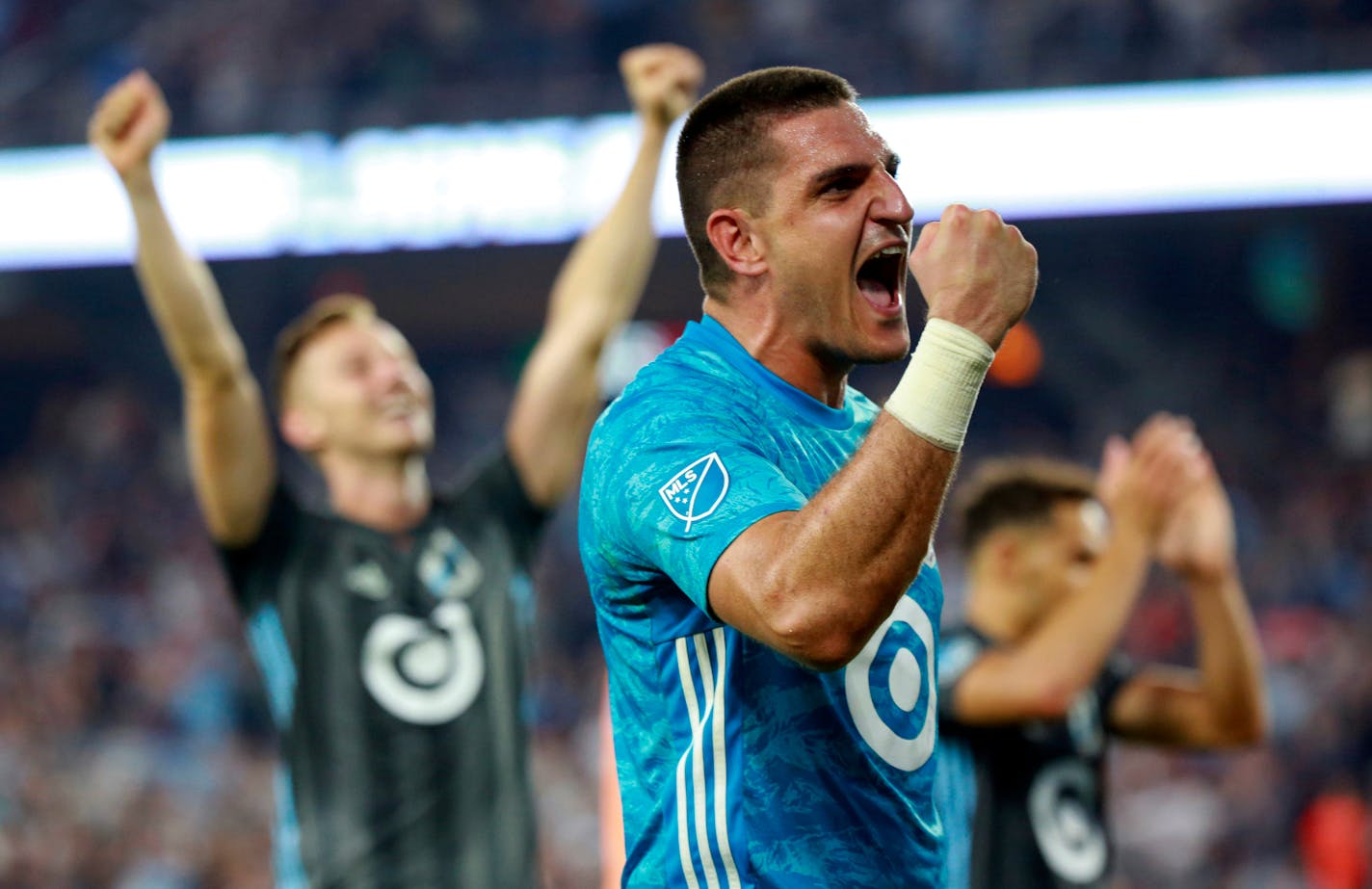 Vito Mannone, foreground, celebrates with his team after a win over FC Dallas