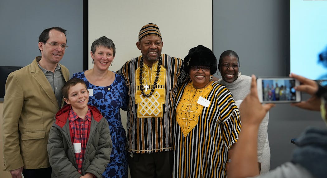 After Kelly Maynard and Henry Byrd met, their families jumped in to share greetings and thanks. From left, Lynn  Varco, Kelly's husband, and her younger son; Henry and his wife, Bonnae, and his niece Franeda Williams. Taking the picture is the Byrds' youngest daughter, Rafonne Rucker.