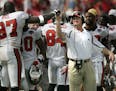 Tampa Bay Buccaneers coach Jon Gruden, right, celebrates with Simeon Rice (97) late in the fourth quarter against the Buffalo Bills on Sunday, Sept. 1