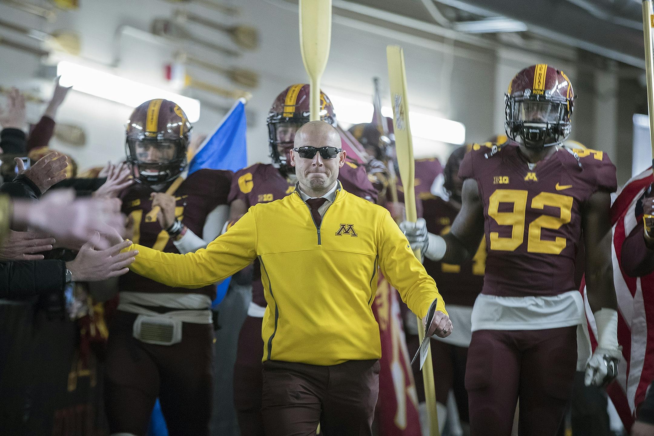 Minnesota coach P. J. Fleck led the team down the tunnel before Minnesota took on Wisconsin at TCF Bank Stadium