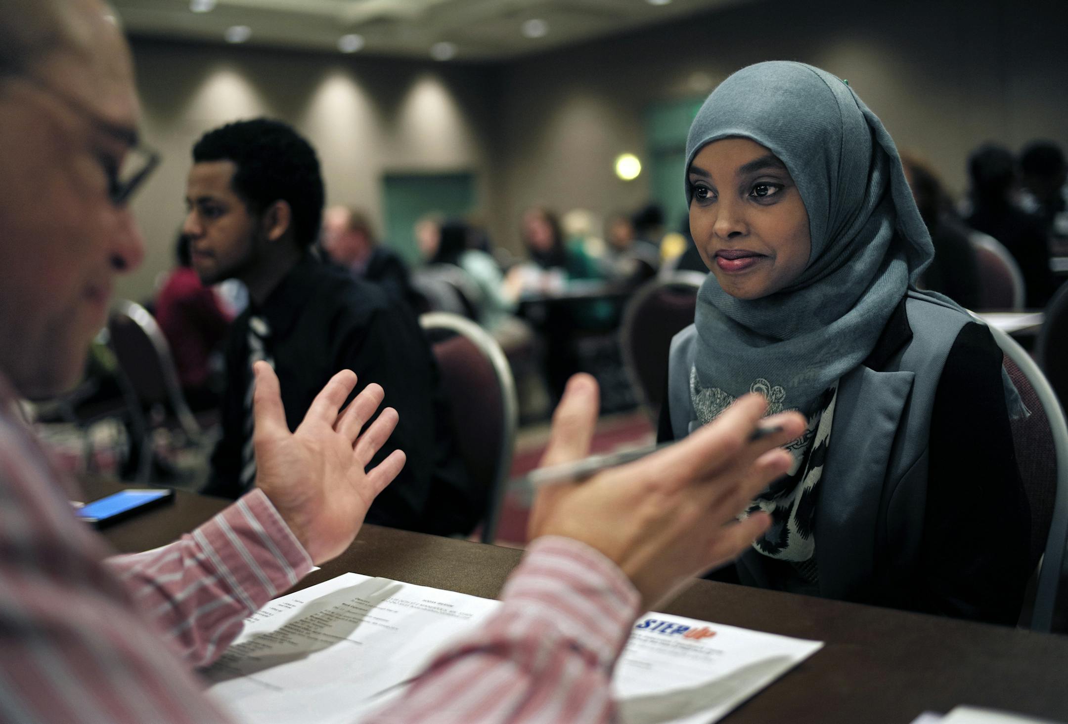 At the Minneapolis Convention Center where Step Up held mock interviews for kids 14 to 21, Lucien Justin who works for US Bank chatted with Hoban Ibrahim,18, a Southwest H.S. student who hopes to work in a law office and become a lawyer in the future. This will be her fourth year in the program. She received high marks for her interview .]richard.tsong-taatarii/rtsong-taatarii@startribune.com