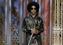 Prince presented an award at the 72nd Annual Golden Globe Awards on Jan. 11, 2015, at the Beverly Hilton Hotel in Beverly Hills, Calif.