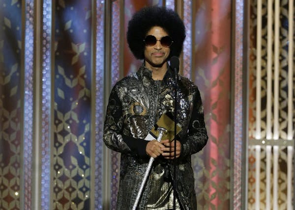 Prince presented an award at the 72nd Annual Golden Globe Awards on Jan. 11, 2015, at the Beverly Hilton Hotel in Beverly Hills, Calif.