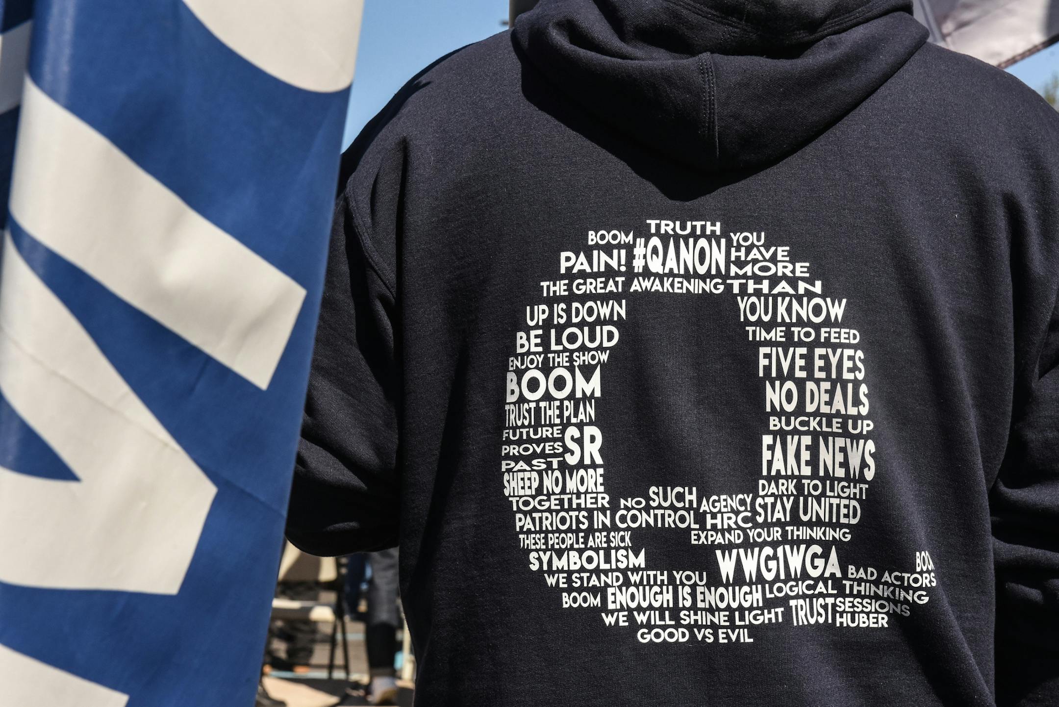 A person wears a QAnon sweatshirt during a pro-Trump rally on Oct. 3, 2020 in the borough of Staten Island in New York City. (Stephanie Keith/Getty Images/TNS) ORG XMIT: 1799084