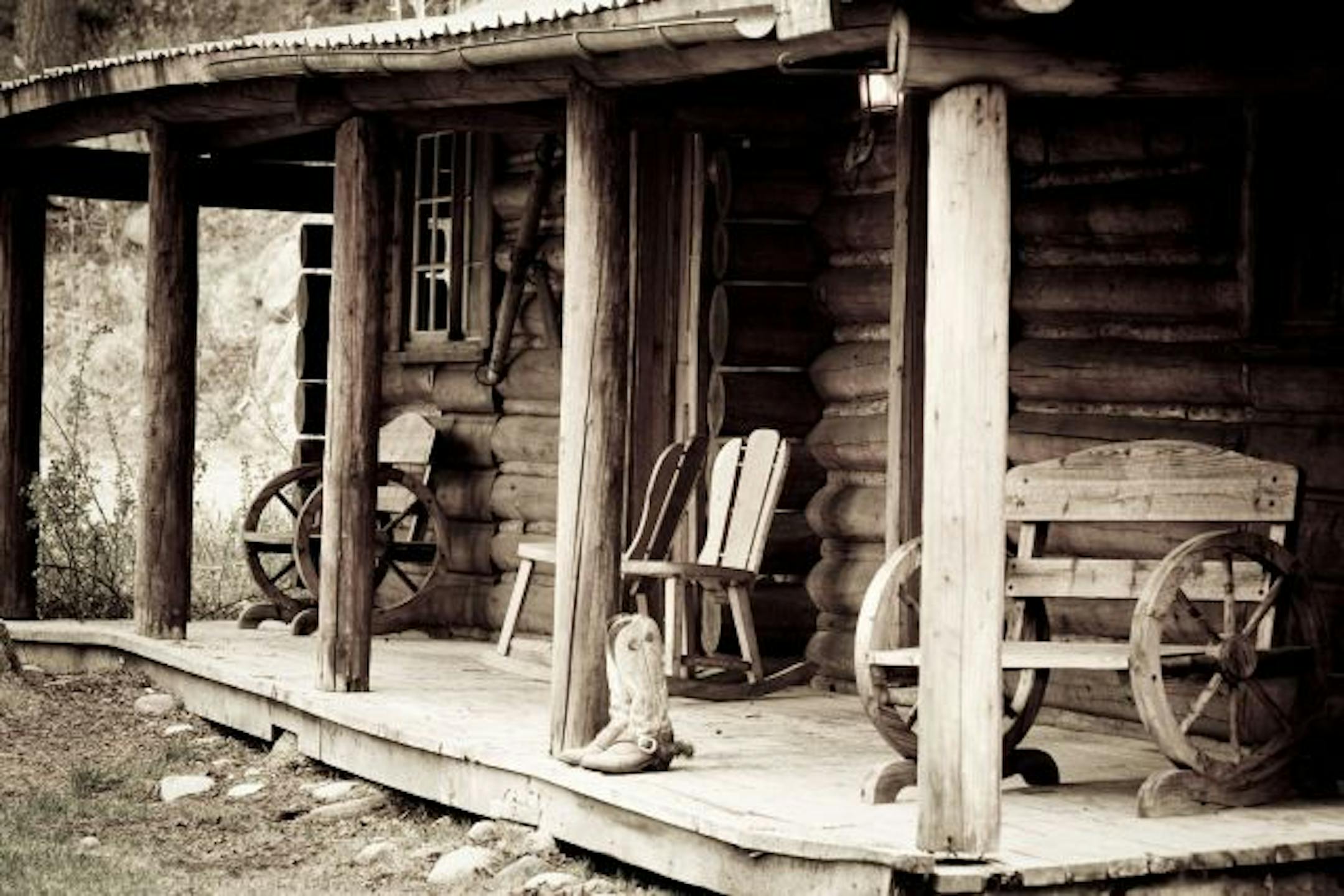 After a day of riding at Gros Ventre River Ranch outside Jackson Hole, Wyo., visitors can shed their boots and kick back in a rocker on a cabin porch to watch the sun set over the Grand Tetons.