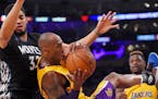 Lakers forward Kobe Bryant came down with a rebound while under pressure from Timberwolves center Karl-Anthony Towns. Bryant scored 38 points in the g