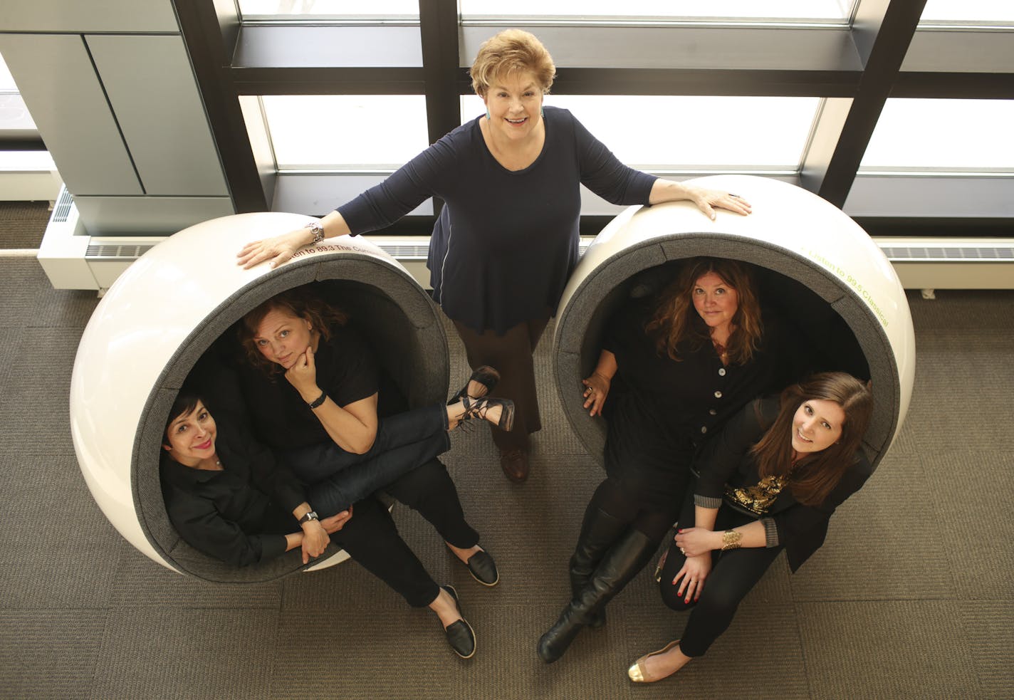 The staff of one of American Public Media's best loved shows, "The Splendid Table," led by host Lynne Rossetto Kasper, standing, in the lobby of MPR's St. Paul headquarters Monday afternoon. The others are, from left, Sally Swift, Jennifer Luebke, Jennifer Russell, and Laura Kaliebe.