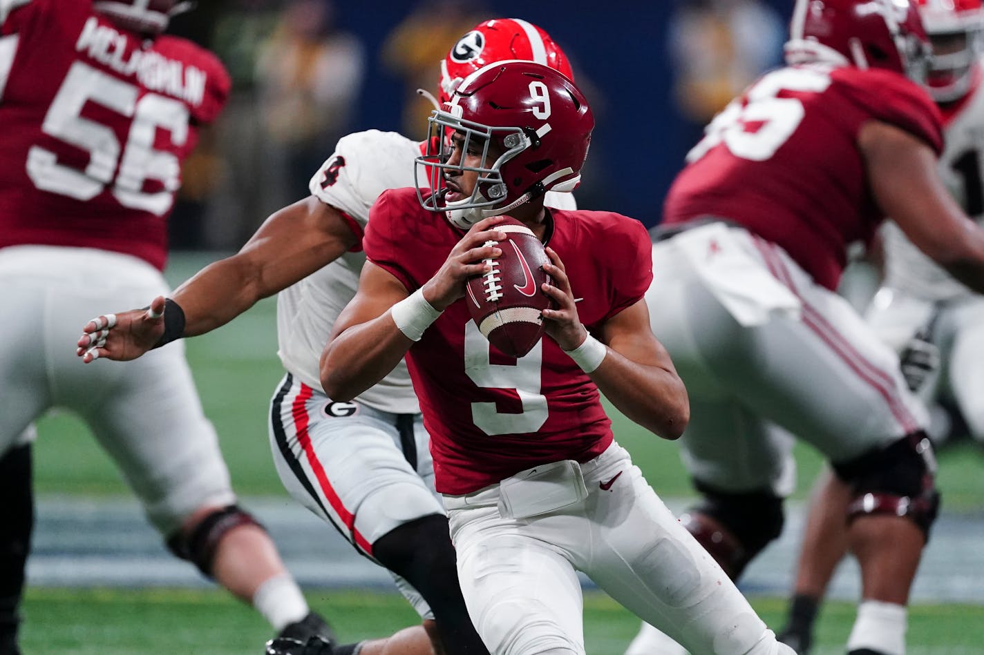 FILE - Alabama quarterback Bryce Young (9) works against Georgia during the second half of the Southeastern Conference championship NCAA college football game Dec. 4, 2021, in Atlanta. Alabama will face the fourth-ranked Bearcats (13-0) at the CFP semifinal Cotton Bowl on Friday, Dec. 31. (AP Photo/John Bazemore, File)