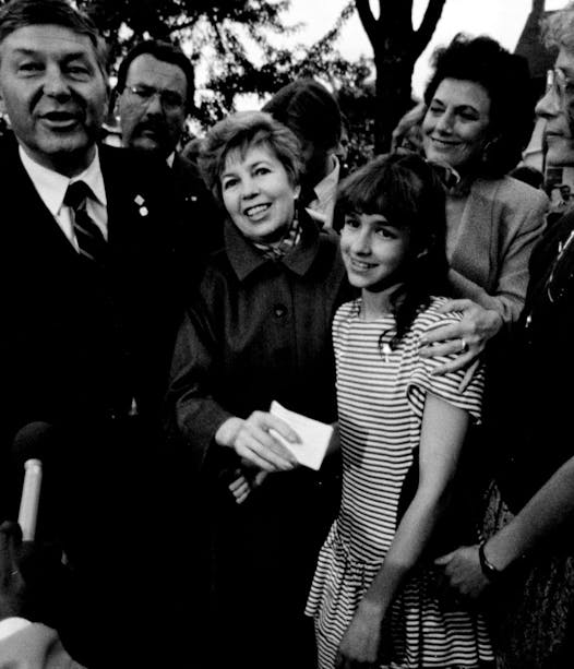 Raisa Gorbachev holds 13-year-old Lisa Watson’s hand.