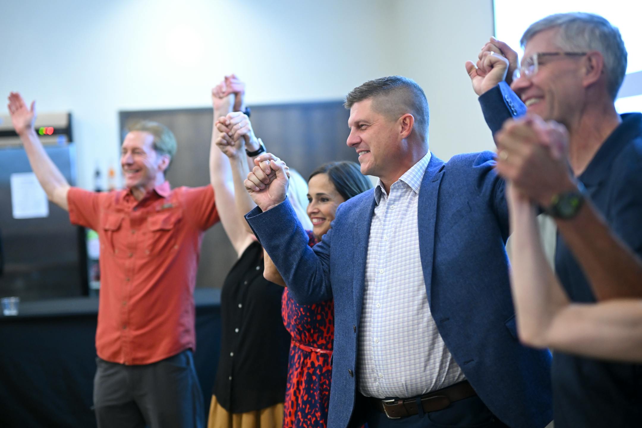 GOP congressional candidate Brad Finstad poses for a photo alongside his wife, Jaclyn, and fellow politicians, including former Representative Erik Paulsen and current U.S. Rep. Michelle Fischbach during an election night party.
