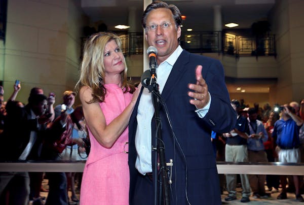 Dave Brat, stands with his wife, Laura, as he speaks to supporters after defeating Republican Congressman Eric Cantor in the Republican primary for th