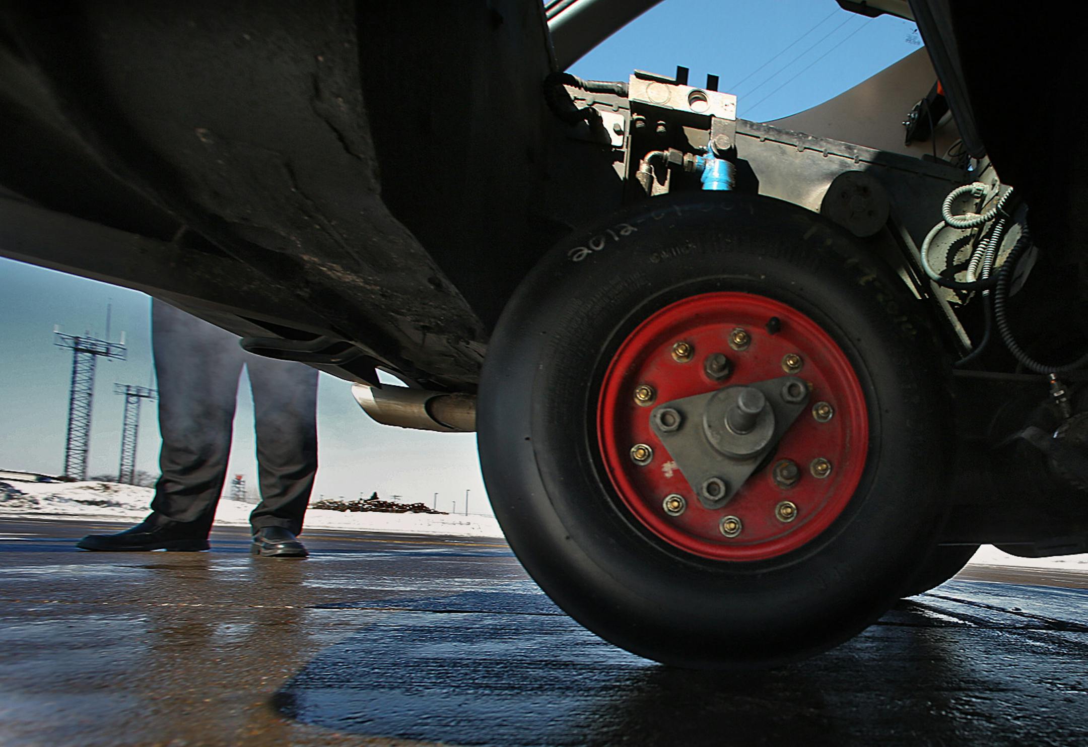 A wheel is dropped from the car’s trunk to calculate the coefficient of friction, the key measurement of snow-clearing effectiveness. Here’s another: The airport has not suspended runway traffic once this winter.