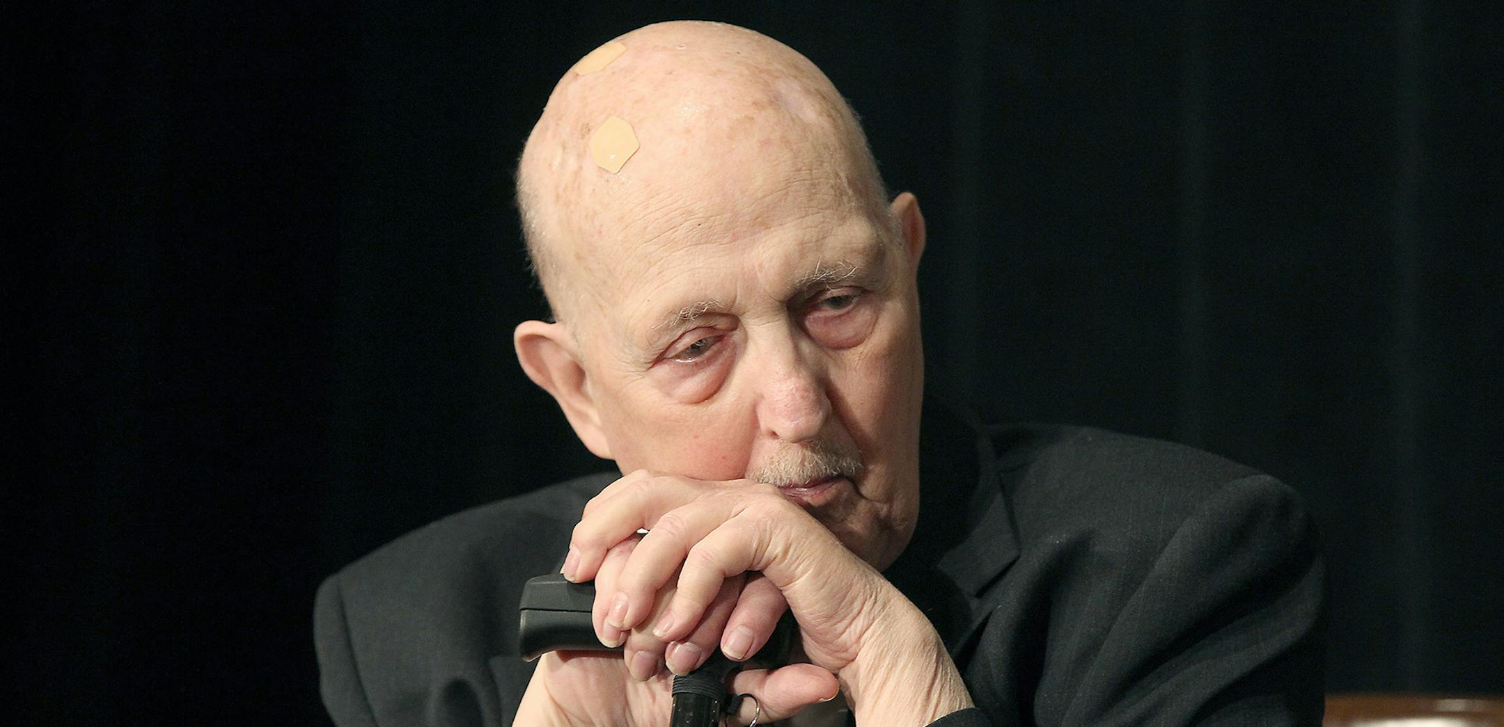 In a Thursday, May 7, 2015 photo, former St. Paul Mayor Larry Cohen, 1972-1976, listens to other mayors as they speak during the annual Saint Paul Foundation breakfast, at the St. Paul Hotel in St. Paul, Minn. Cohen died at home Sunday, Sept. 11, 2016, surrounded by his family, according to his son, Scott. He was 83. (Elizabeth Flores/Star Tribune via AP) ORG XMIT: MIN2016091211024314