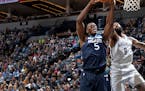 The Wolves' Gorgui Dieng (5) and the Nets' DeAndre Jordan battled for a rebound in the second quarter Monday. Dieng finished with 20 rebounds.