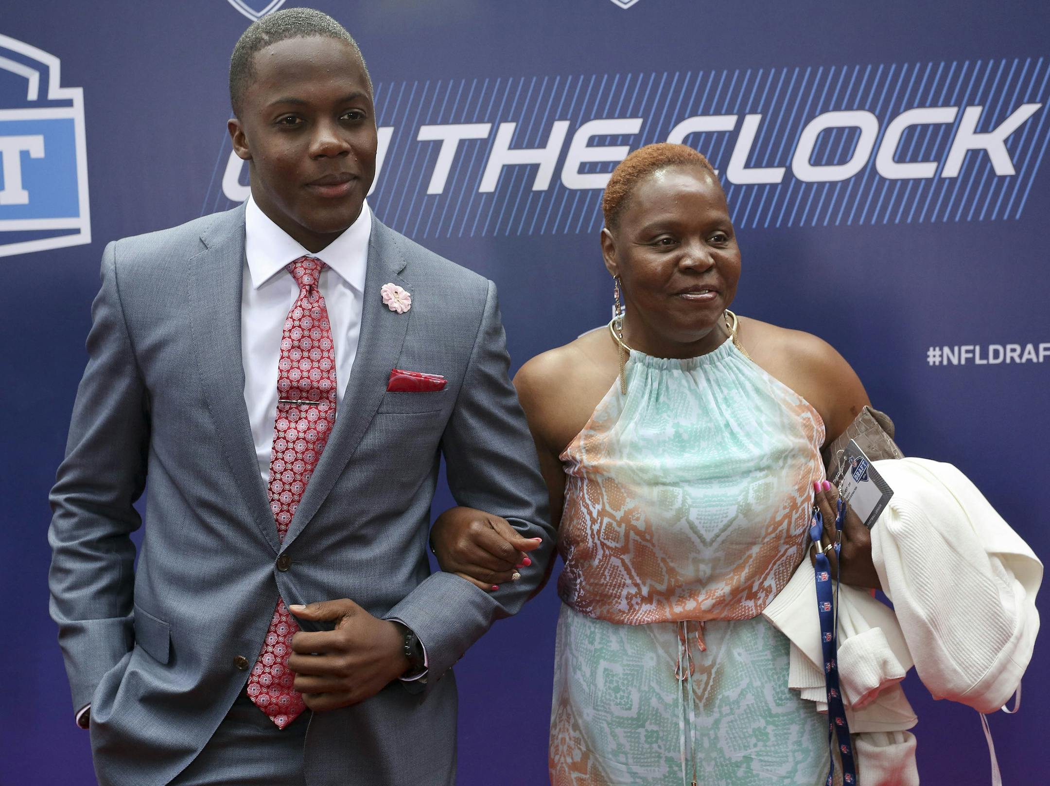 Louisville quarterback Teddy Bridgewater poses for photos with his mother, Rose Murphy, upon arriving for the first round of the 2014 NFL Draft, Thursday, May 8, 2014, in New York. (AP Photo/Craig Ruttle)