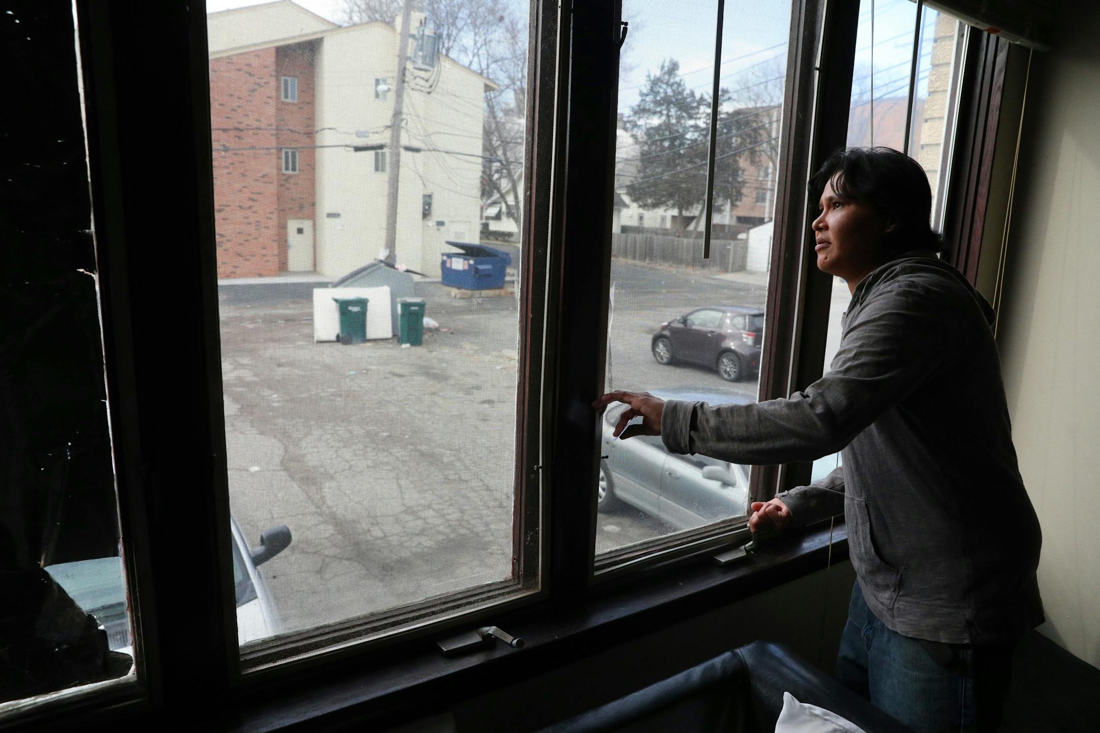 Bridget Peake showed the damaged windows in the living room of her apartment.
