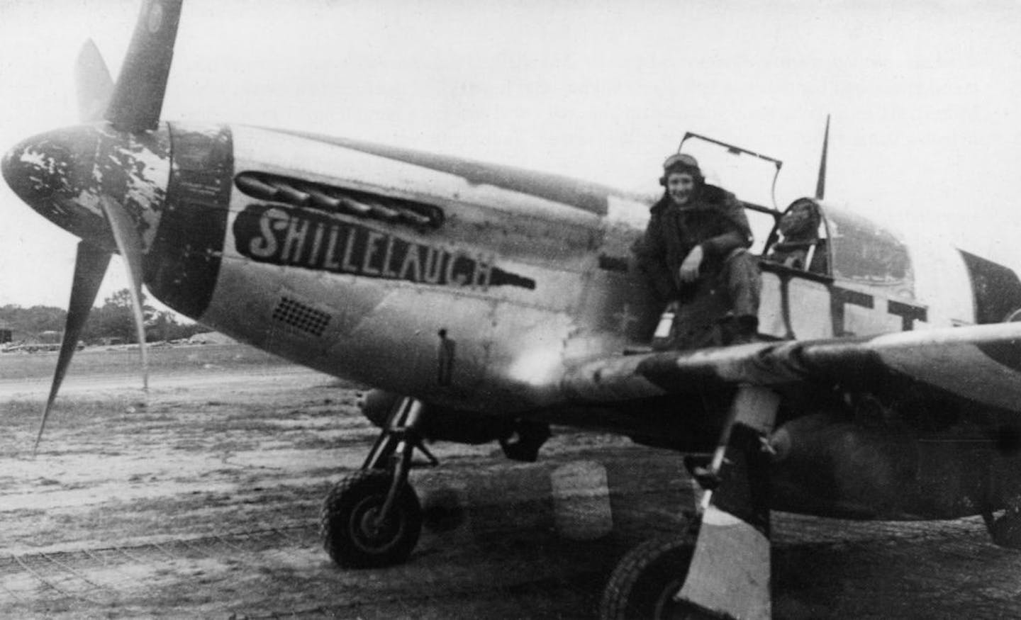 Ken Dahlberg on the wing of the plane named "Shillelaugh"