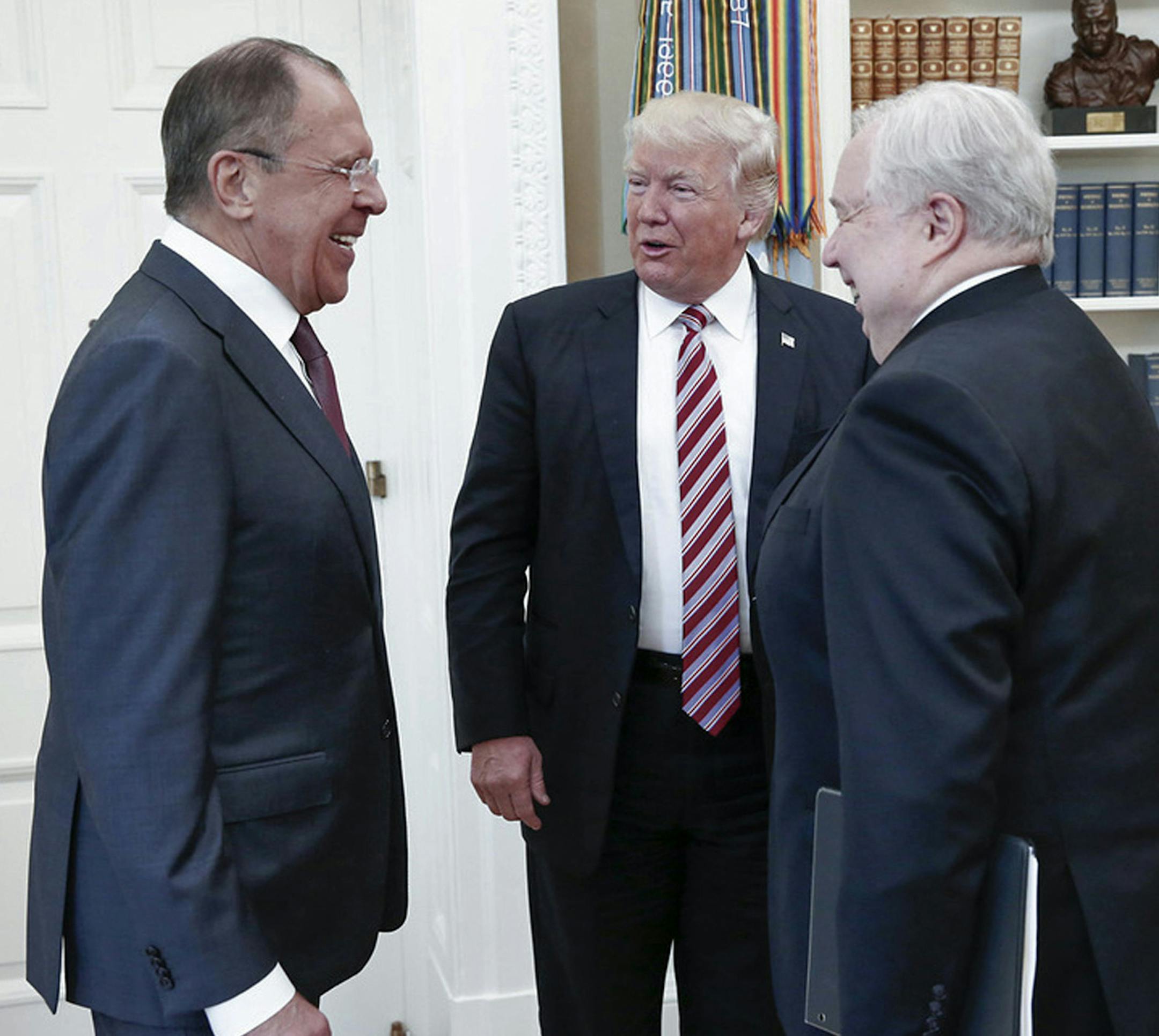 U.S. President Donald Trump meets with Russian Foreign Minister Sergey Lavrov, left, next to Russian Ambassador to the U.S. Sergei Kislyak at the White House in Washington, Wednesday, May 10, 2017. Trump on Wednesday welcomed Vladimir Putin's top diplomat to the White House for Trump's highest level face-to-face contact with a Russian government official since he took office in January. (Russian Foreign Ministry Photo via AP) ORG XMIT: MIN2017051211301917
