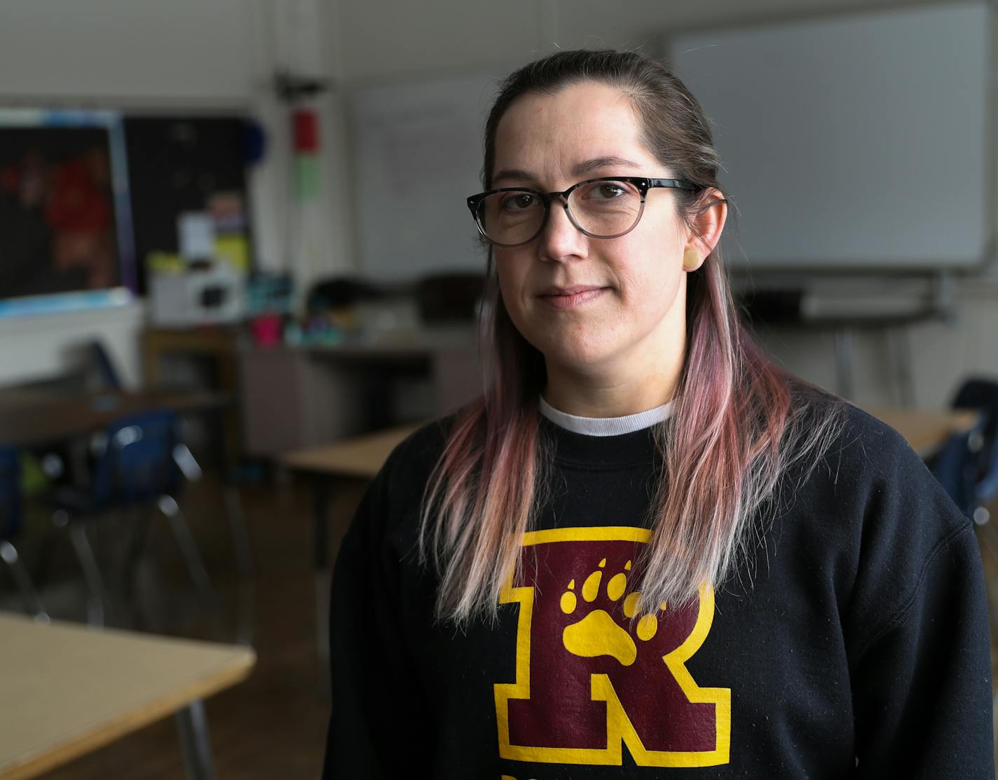 Sasha Yunginger was photographed inside her Roosevelt High School classroom. ] Shari L. Gross &#x2022; shari.gross@startribune.com You'll be photographing Sasha Yunginger, a Special Education Resource Teacher at Roosevelt High School. She's in the story because she has about $126,000 in debt. Just looking for a nice portrait of her.