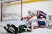 New York Islanders defenseman Adam Pelech (50) was unable to stop the puck as Minnesota Wild left wing Marcus Foligno (17) scored a goal on New York I