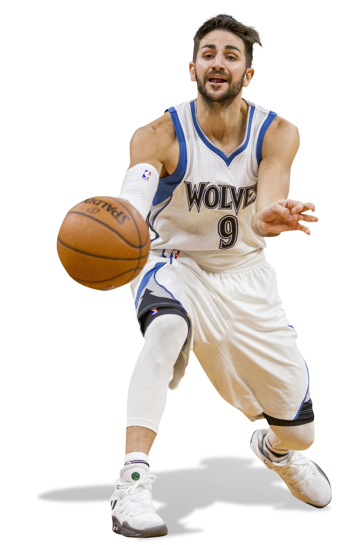 Minnesota Timberwolves guard Ricky Rubio (9) passes the ball against the San Antonio Spurs in the second half of an NBA basketball game Tuesday, Dec. 6, 2016, in Minneapolis. The Spurs won 105-91. (AP Photo/Bruce Kluckhohn) ORG XMIT: MIN2016122010190111