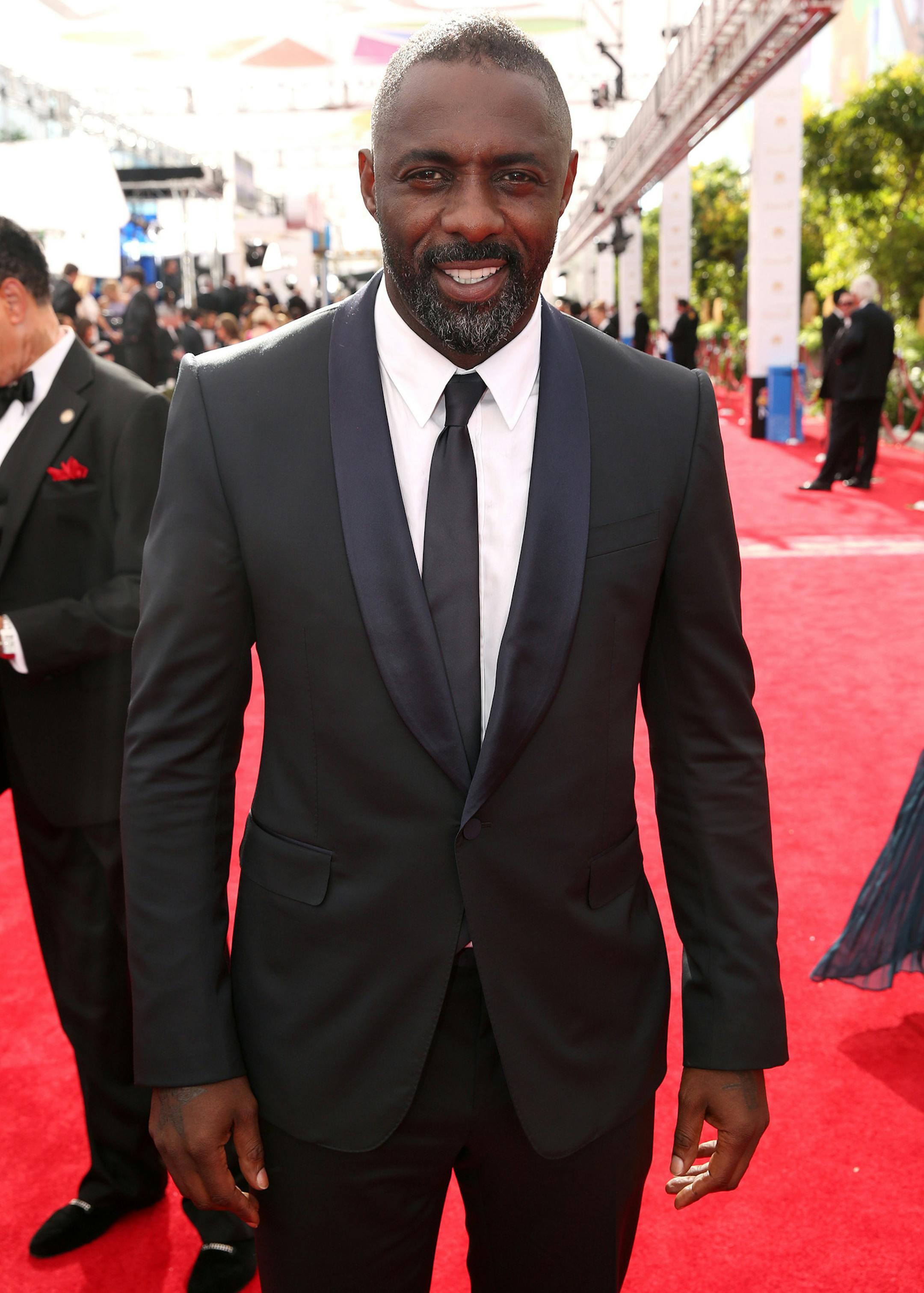Idris Elba arrives at the 66th Primetime Emmy Awards at the Nokia Theatre L.A. Live on Monday, Aug. 25, 2014, in Los Angeles. (Photo by Matt Sayles/Invision for the Television Academy/AP Images) ORG XMIT: INVL