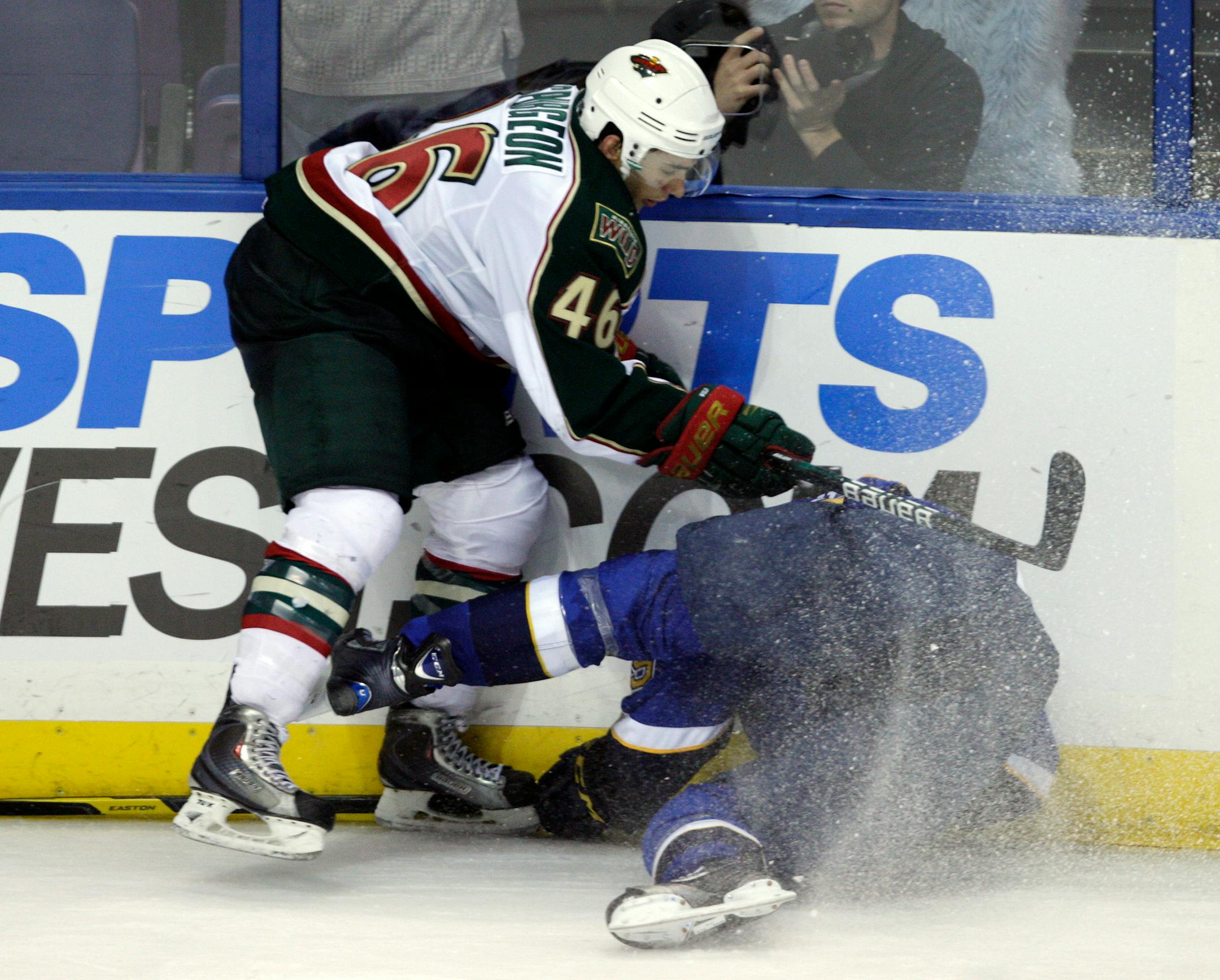 Wild defenseman Jared Spurgeon (46) sent Blues center Philip McRae into the boards, drawing a boarding penalty, in the third period of Thursday's preseason game.