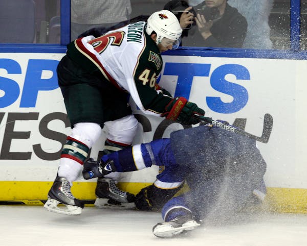 Wild defenseman Jared Spurgeon (46) sent Blues center Philip McRae into the boards, drawing a boarding penalty, in the third period of Thursday's pres