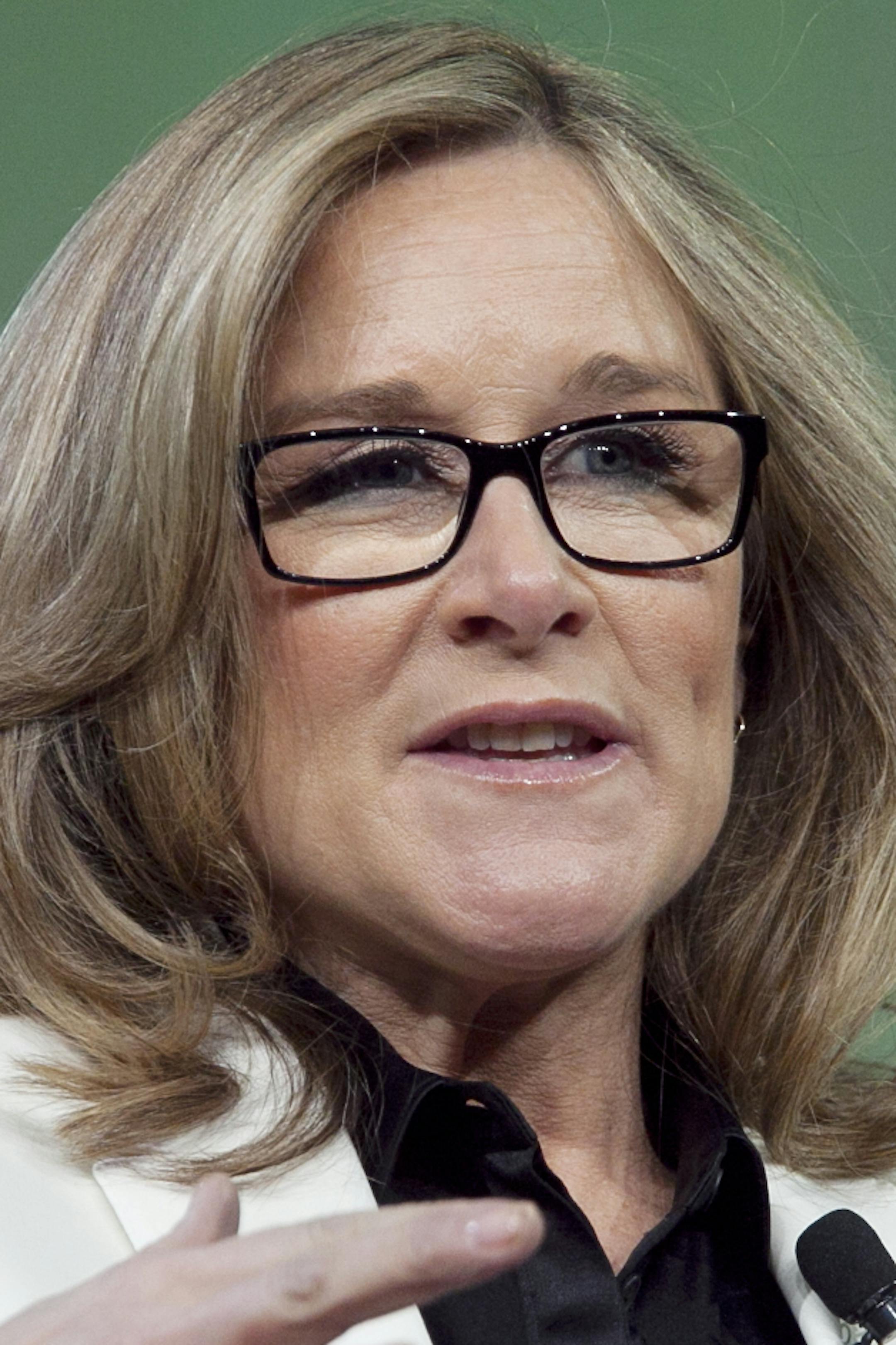 FILE - In this Wednesday, Jan. 18, 2012, file photo, Burberry CEO Angela Ahrendts speaks at the National Retail Federation's annual convention in New York. Apple said Tuesday, Oct. 15, 2013, that Ahrendts, who used technology to drive a remarkable turnaround at Burberry, will take charge of Apple's expansion plans and retail operation, as she will become a senior vice president at the company next spring. (AP Photo/Mark Lennihan, File)