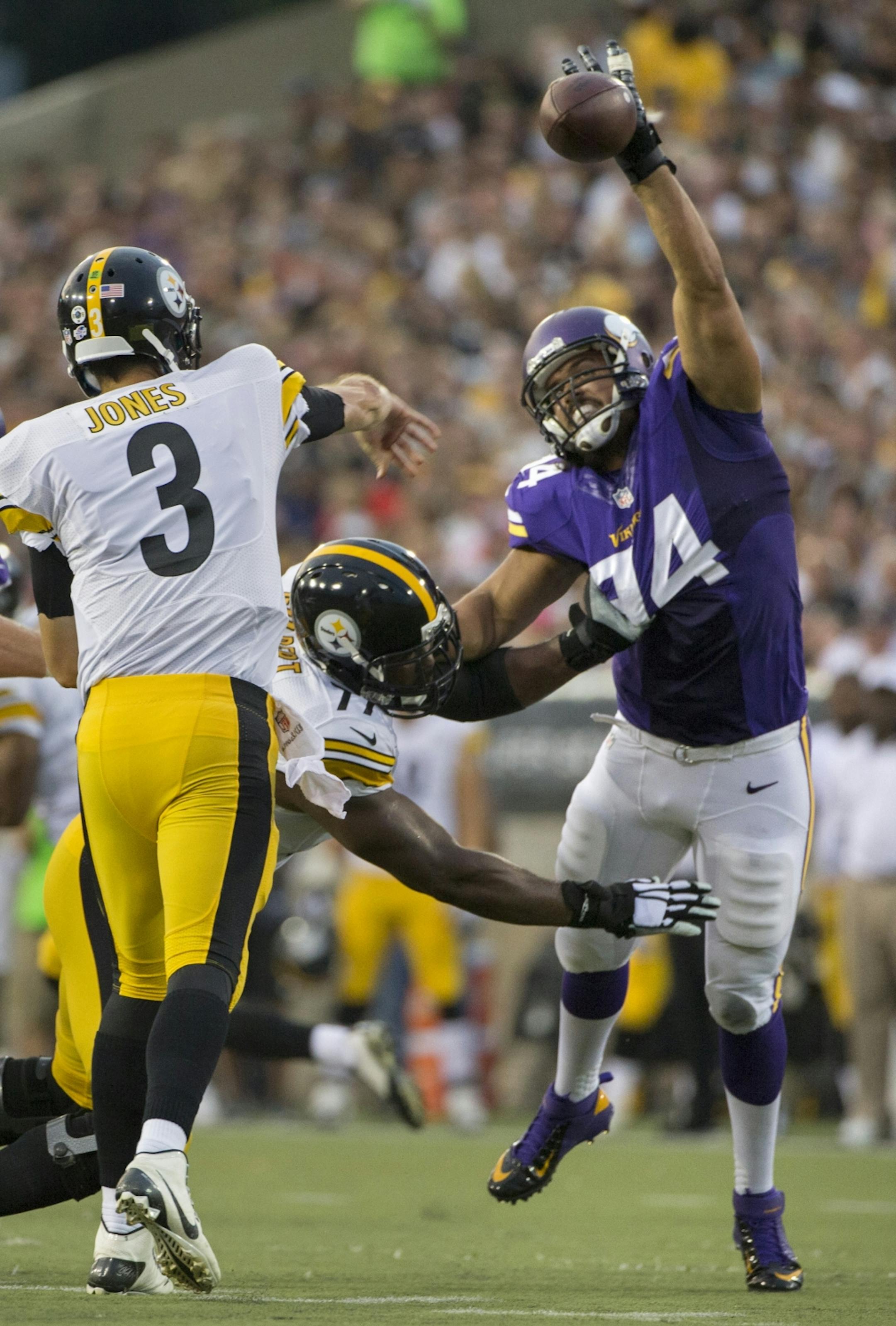 Vikings Justin Trattou bats a ball incomplete during the 1st quarter of the 1st preseason game of the season.