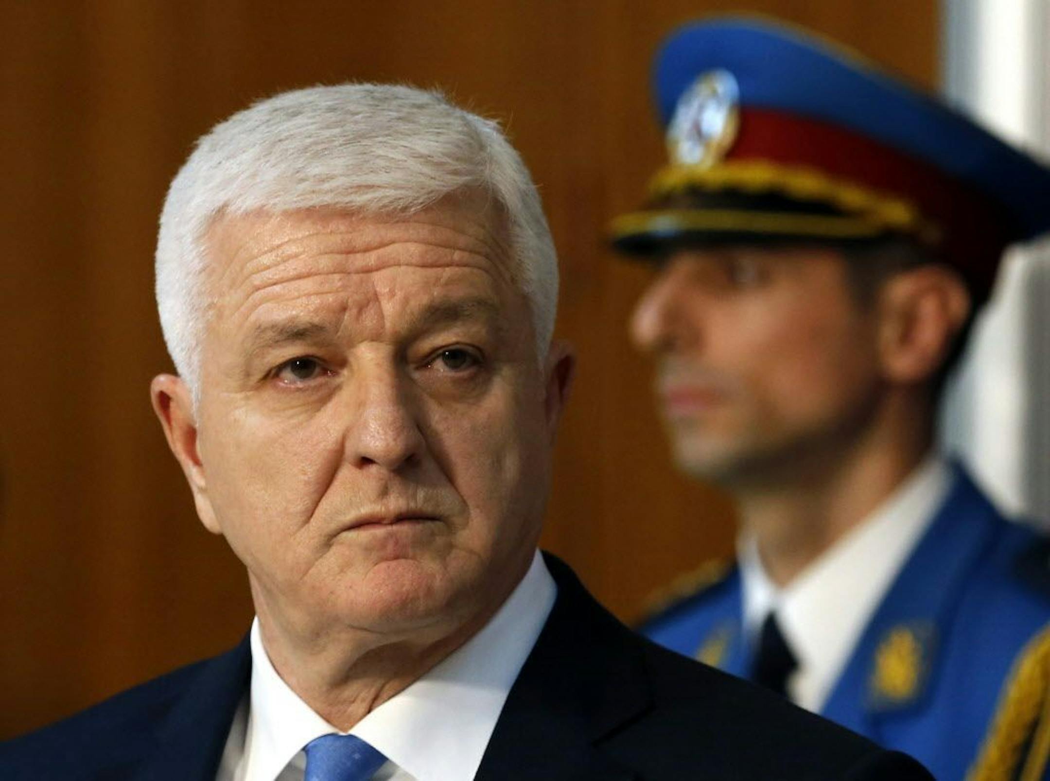 FILE - In this Friday, Feb. 3, 2017 file photo, Montenegro's Prime Minister Dusko Markovic listens to his Serbian counterpart Aleksandar Vucic, not pictured, during a press conference after talks at the Serbia Palace in Belgrade, Serbia. Montenegro's prime minister has called Russia's expulsion of a Montenegrin official "destructive and primitive" and stressed it won't change the tiny Balkan state's pro-Western course.