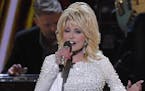 FILE - This Nov. 13, 2019 file photo shows Dolly Parton performing at the 53rd annual CMA Awards in Nashville, Tenn. Parton tweeted Wednesday, April 1