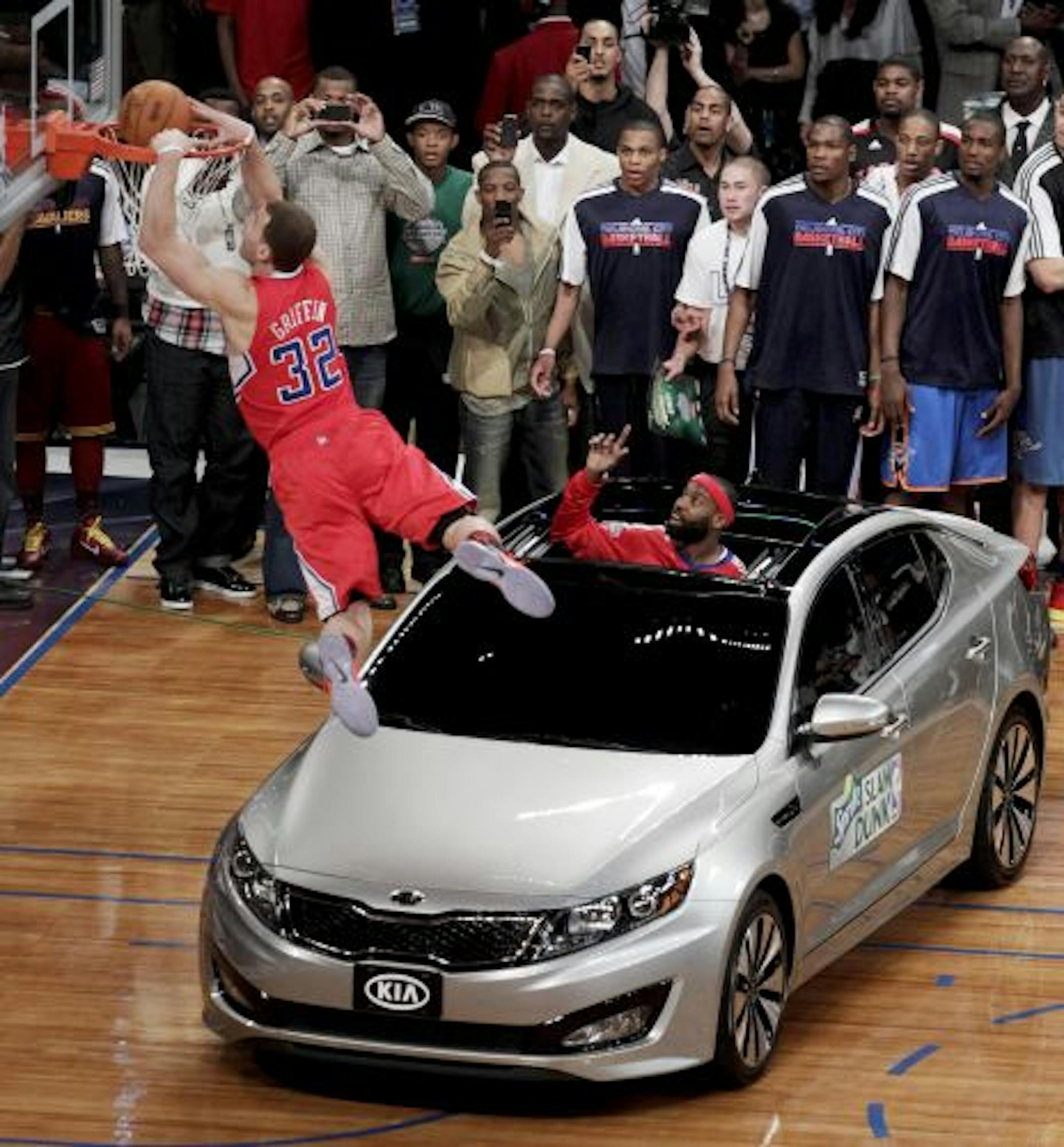 The Clippers' Blake Griffin dunks in traffic.