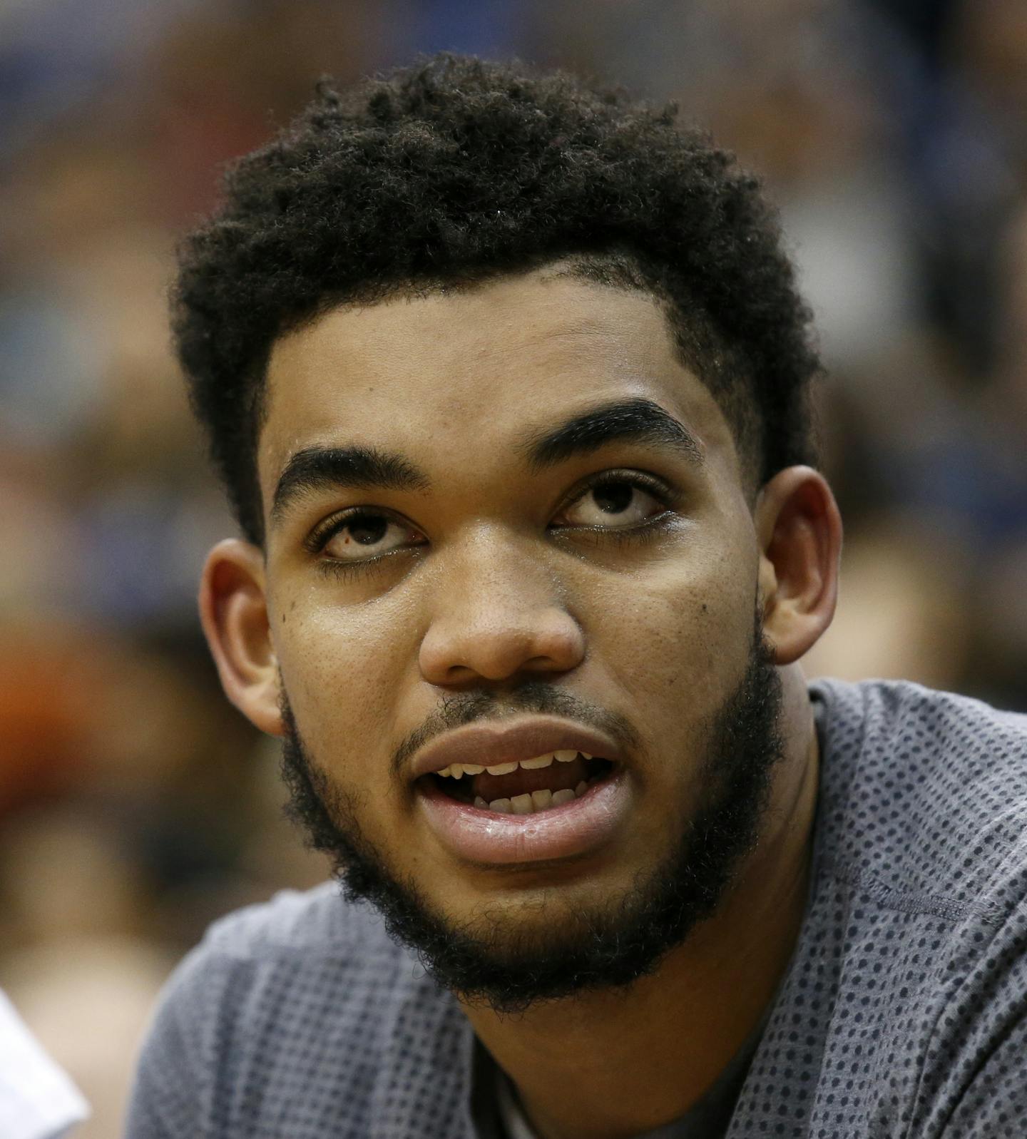 Minnesota Timberwolves center Karl-Anthony Towns talks with a teammate during the second half of an NBA basketball game against the Memphis Grizzlies in Minneapolis, Sunday, Nov. 15, 2015. The Grizzlies won 114-106. (AP Photo/Ann Heisenfelt) ORG XMIT: MIN2015120320462651