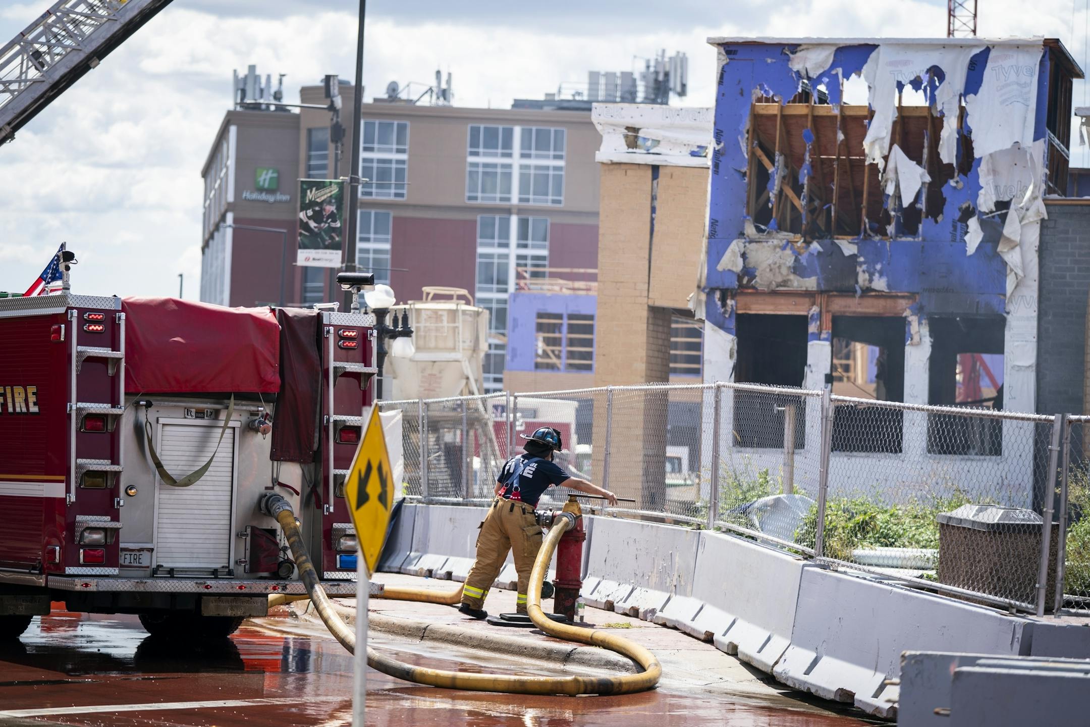 St. Paul firefighters battled a fire at a construction site across from Xcel Energy Center in downtown St. Paul.