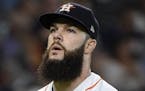 Houston Astros starting pitcher Dallas Keuchel walks to the dugout after completing the sixth inning of a baseball game against the Minnesota Twins, M