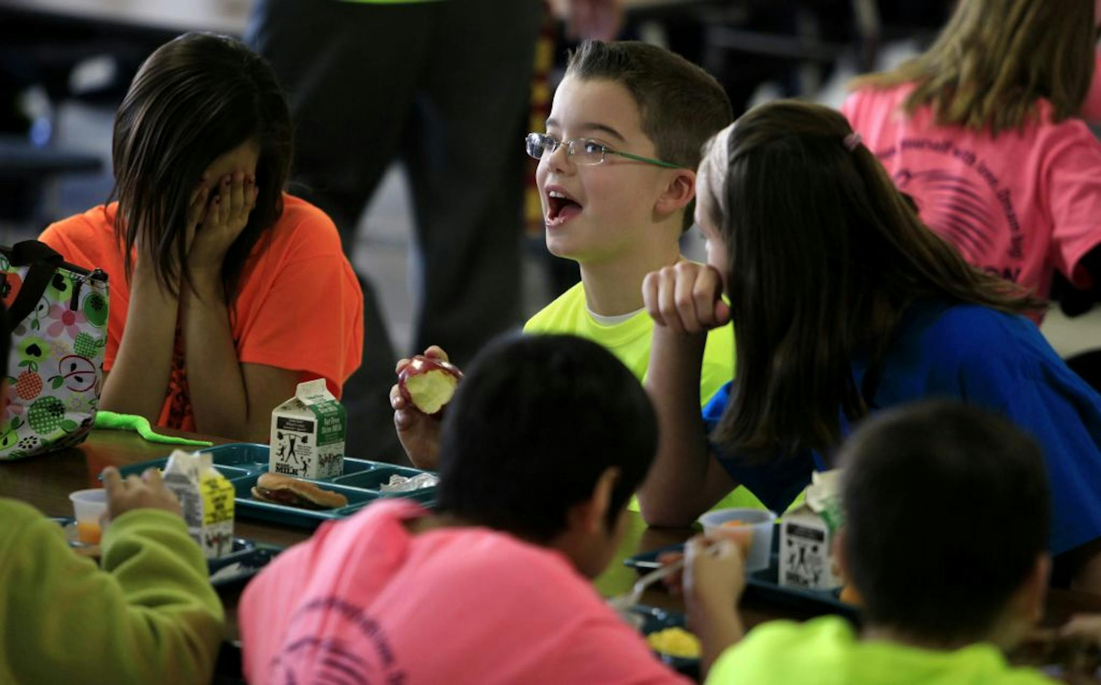 Jarrett Michie, 10, jokes with his classmates during lunch at Diamond Path School in Apple Valley, MN on January 23, 2013.