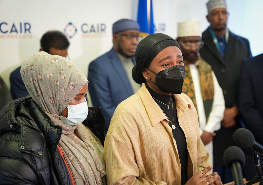 Aram Wedatalla, a student at Hamline and president of the university’s Muslim Student Association, breaks down while addressing the media inside the CAIR-MN office in Minneapolis on Wednesday.