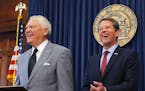 Republican Brian Kemp, right, and Georgia Gov. Nathan Deal hold a news conference in the Governor's ceremonial office at the Capitol on Thursday, Nov.