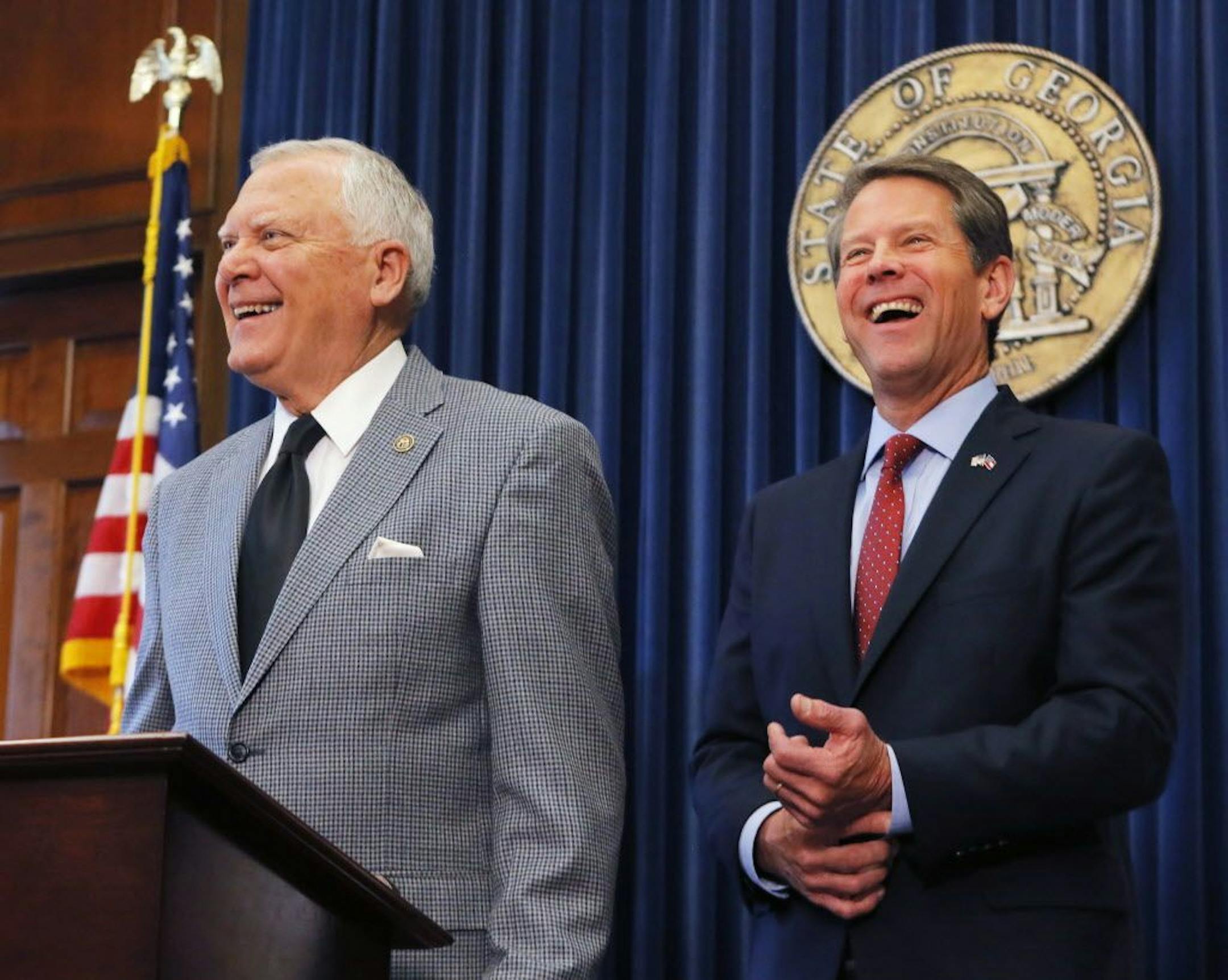Republican Brian Kemp, right, and Georgia Gov. Nathan Deal hold a news conference in the Governor's ceremonial office at the Capitol on Thursday, Nov. 8, 2018, in Atlanta, Ga. Kemp resigned Thursday as Georgia's secretary of state, a day after his campaign said he's captured enough votes to become governor despite his rival's refusal to concede.