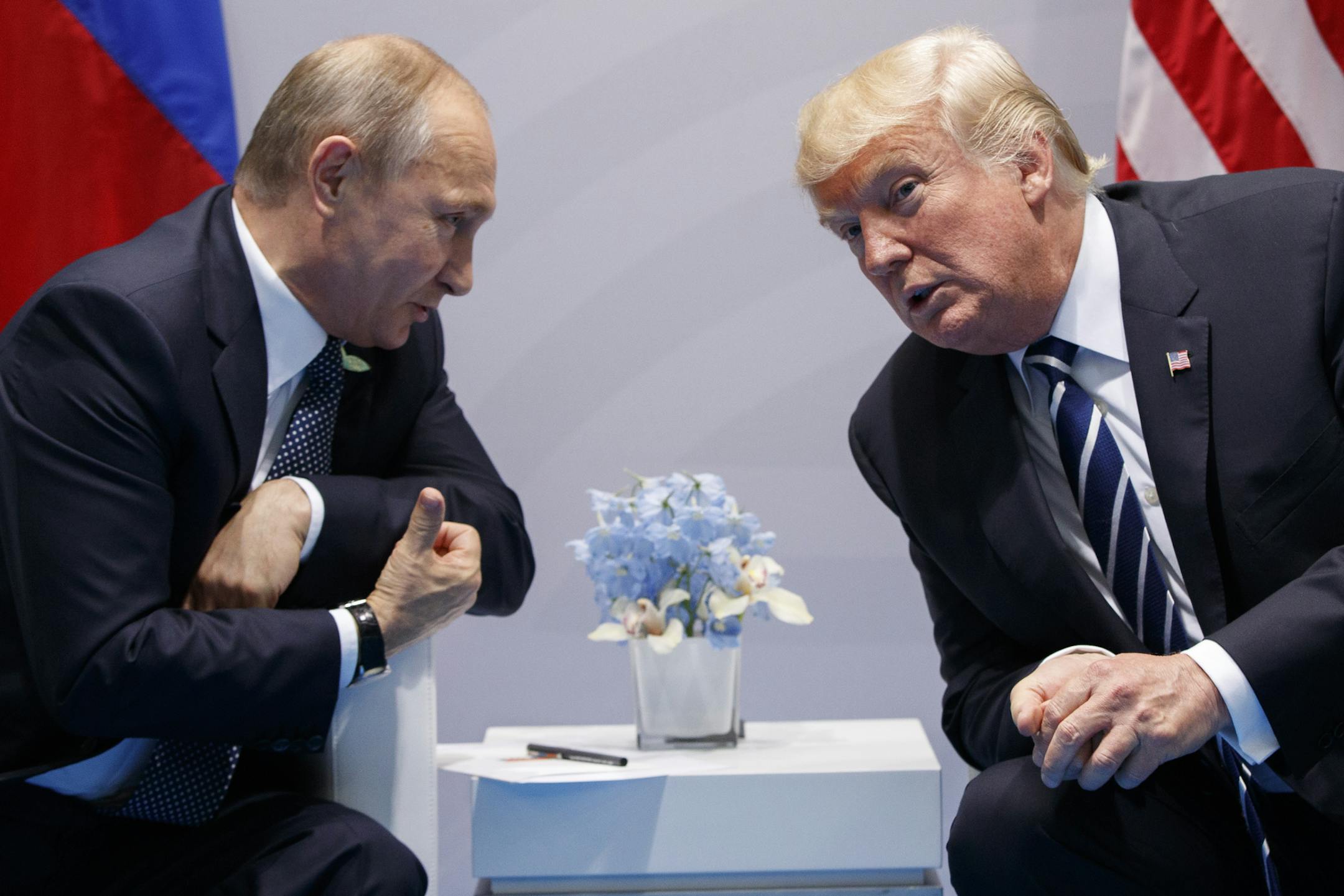 FILE - In this July 7, 2017 file photo, President Donald Trump meets with Russian President Vladimir Putin at the G20 Summit in Hamburg. Putin is more trusted than Trump to do the right thing for the world among citizens of numerous U.S. allies, including Japan, South Korea and seven European NATO members, according to new survey released Wednesday, Aug. 16, 2017. (AP Photo/Evan Vucci, File)