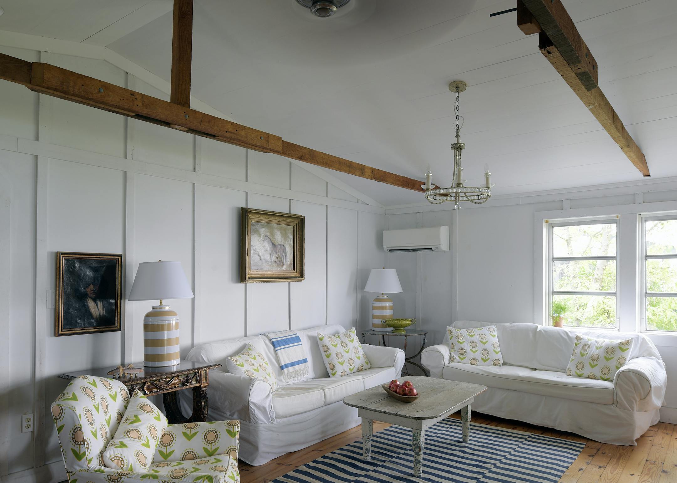 The living room, with its two slipcovered sofas, is a comfortable spot in the house. MUST CREDIT: Washington Post photo by John McDonnell.