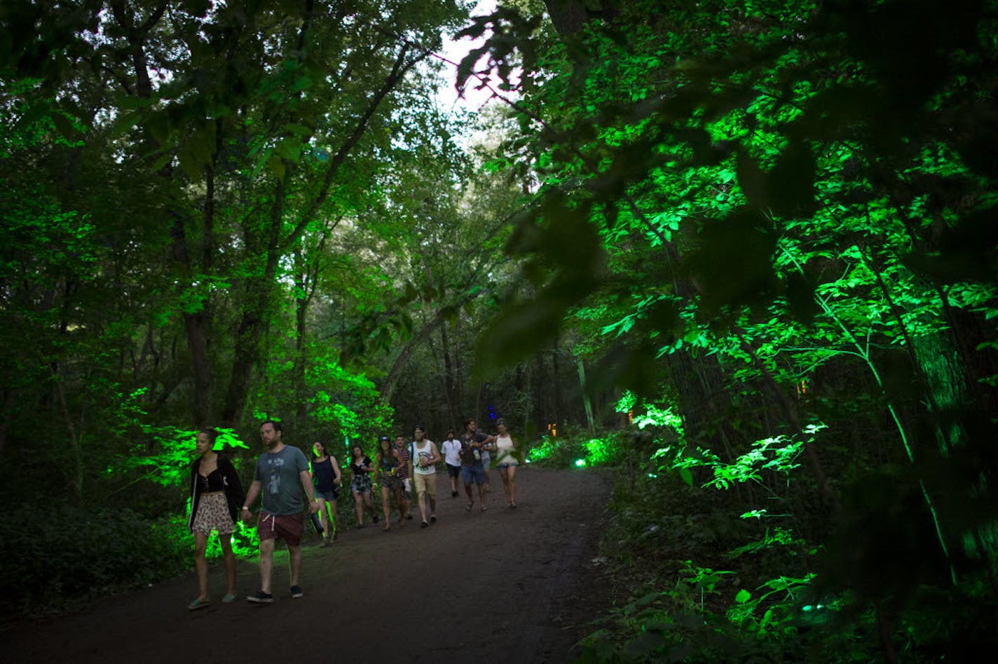 Walks through the artfully lit-up woods are part of the Eaux Claires fest's appeal.