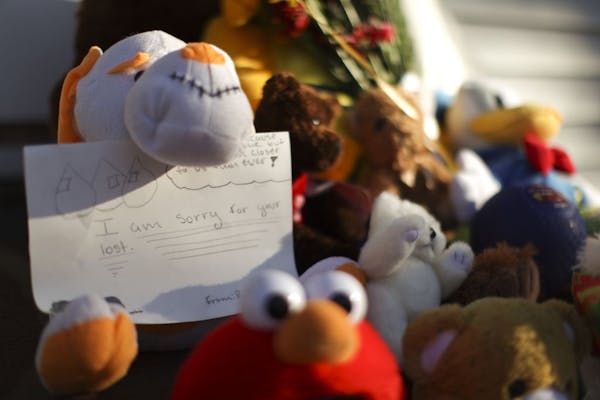 Stuffed animals, balloons and tender notes were put together on the front steps of Terrell Mayes' home in north Minneapolis.