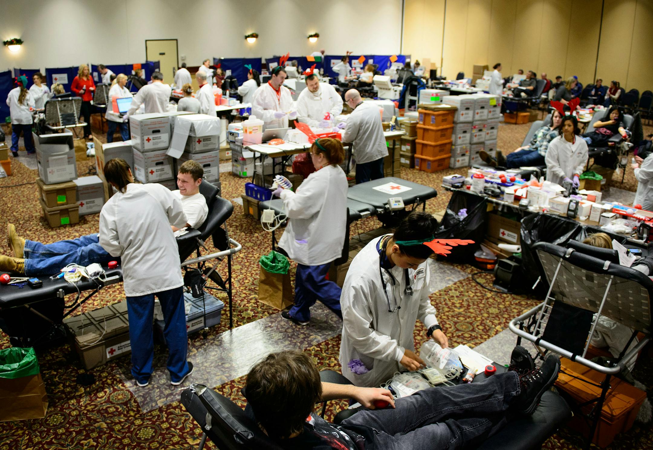 The 12 Hours of Giving event was held Monday at the Prom Center in Oakdale. Donors were treated to free gift wrapping, a Red Cross T-shirt and gift bag, prize drawings and holiday entertainment and food. Sue Thesenga, the organization's community program manager, said Monday night that they were "very close" to reaching their goal of 500 units of blood, needed to replenish supplies when many donors are traveling or busy with holiday activities.