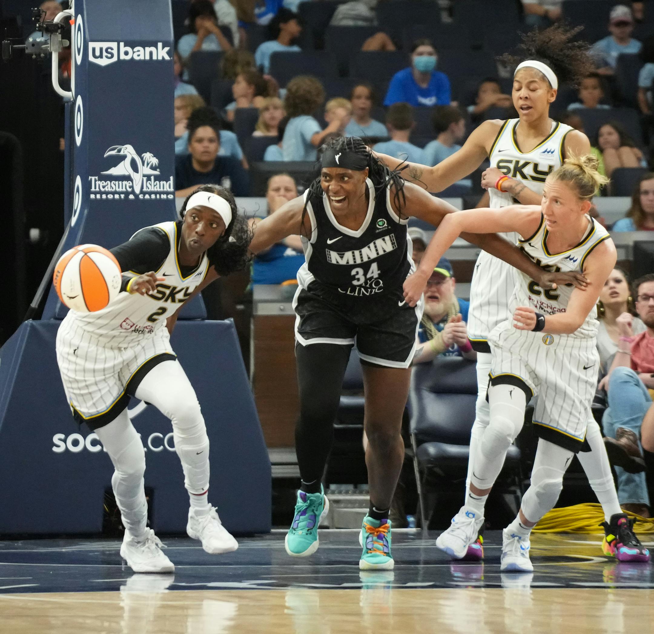 Minnesota Lynx center Sylvia Fowles (34) fights off Chicago Sky's Kahleah Copper (2), Candace Parker (3) and Courtney Vandersloot (22) for a rebound in the second half.