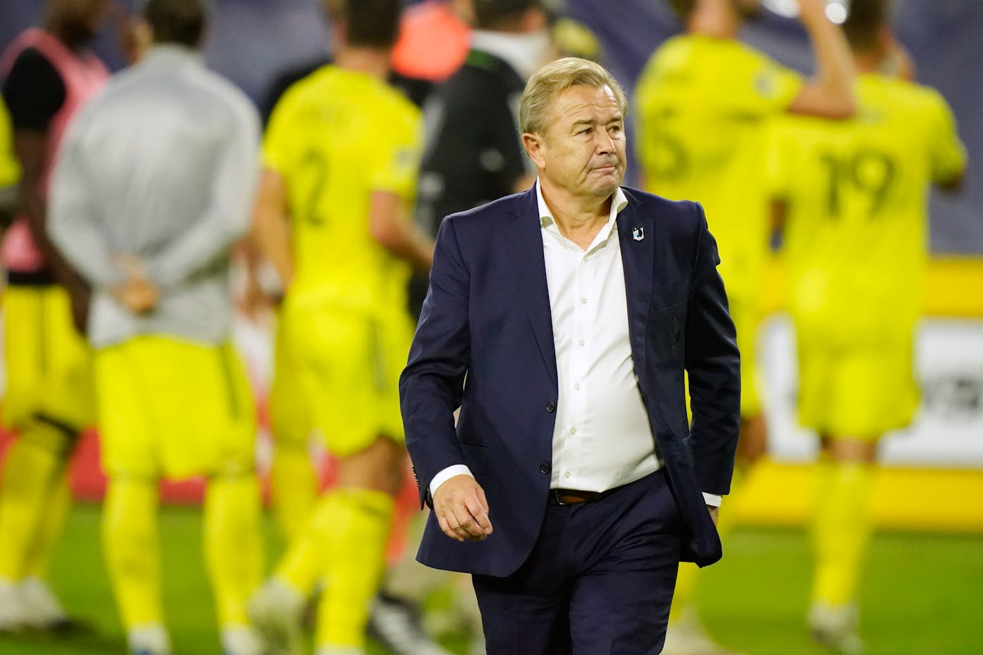 Minnesota United head coach Adrian Heath leaves the pitch after a 0-0 tie against Nashville SC in an MLS soccer match Tuesday, Oct. 6, 2020, in Nashville, Tenn. (AP Photo/Mark Humphrey)